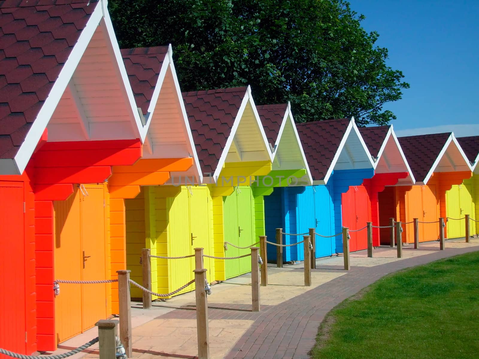 Exteriors of beautiful bright seaside beach chalets, Scarborough, England.