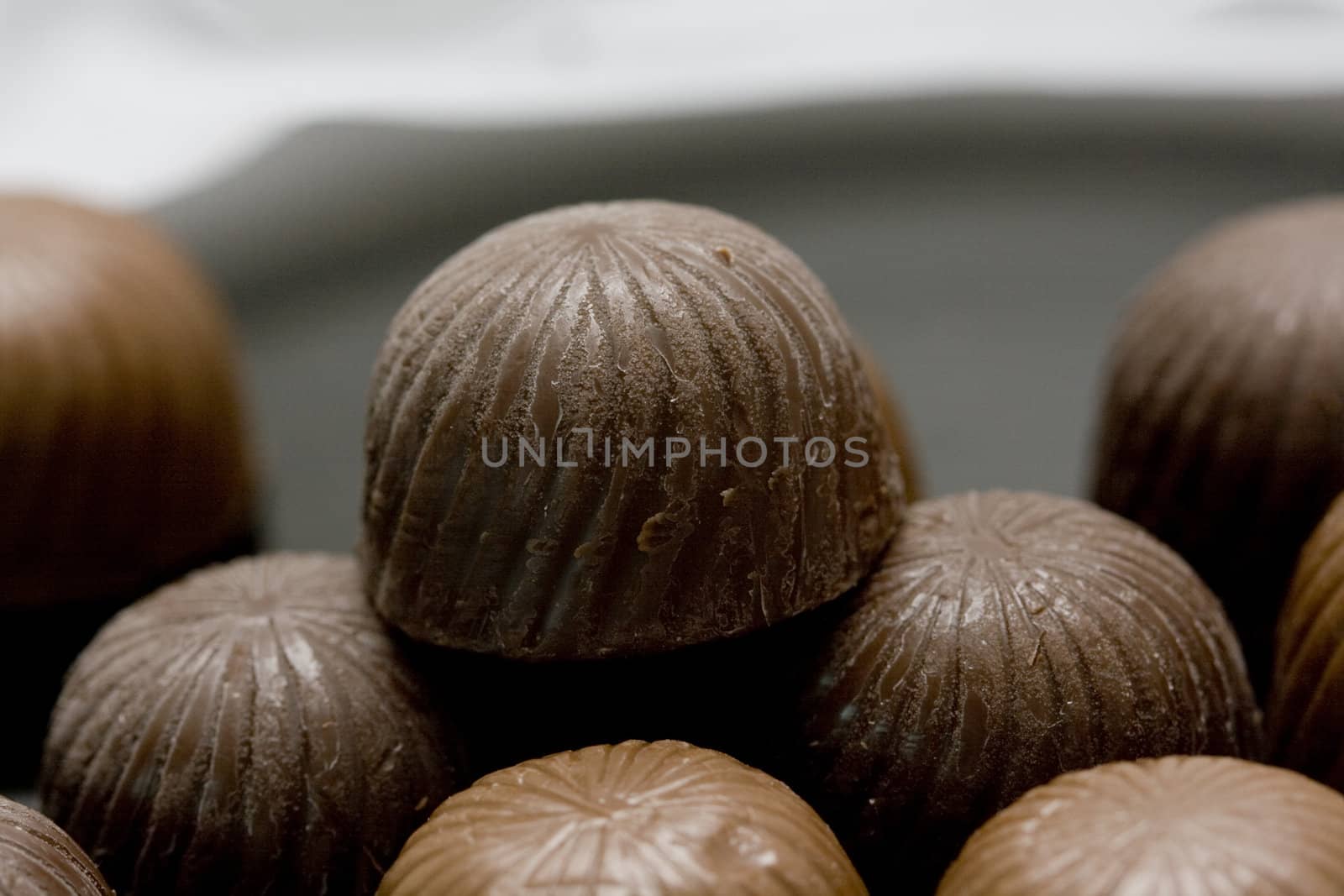 chocolate candies on abstract background