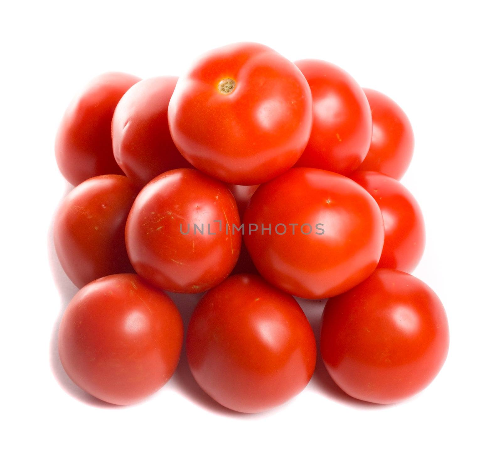 close-up tomatoes in pyramid, isolated on white