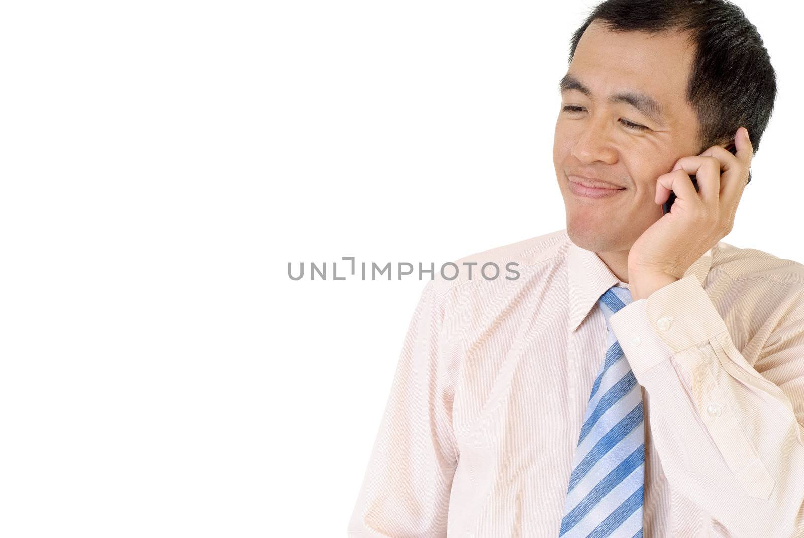 Businessman talk and smile with cellphone on white background.