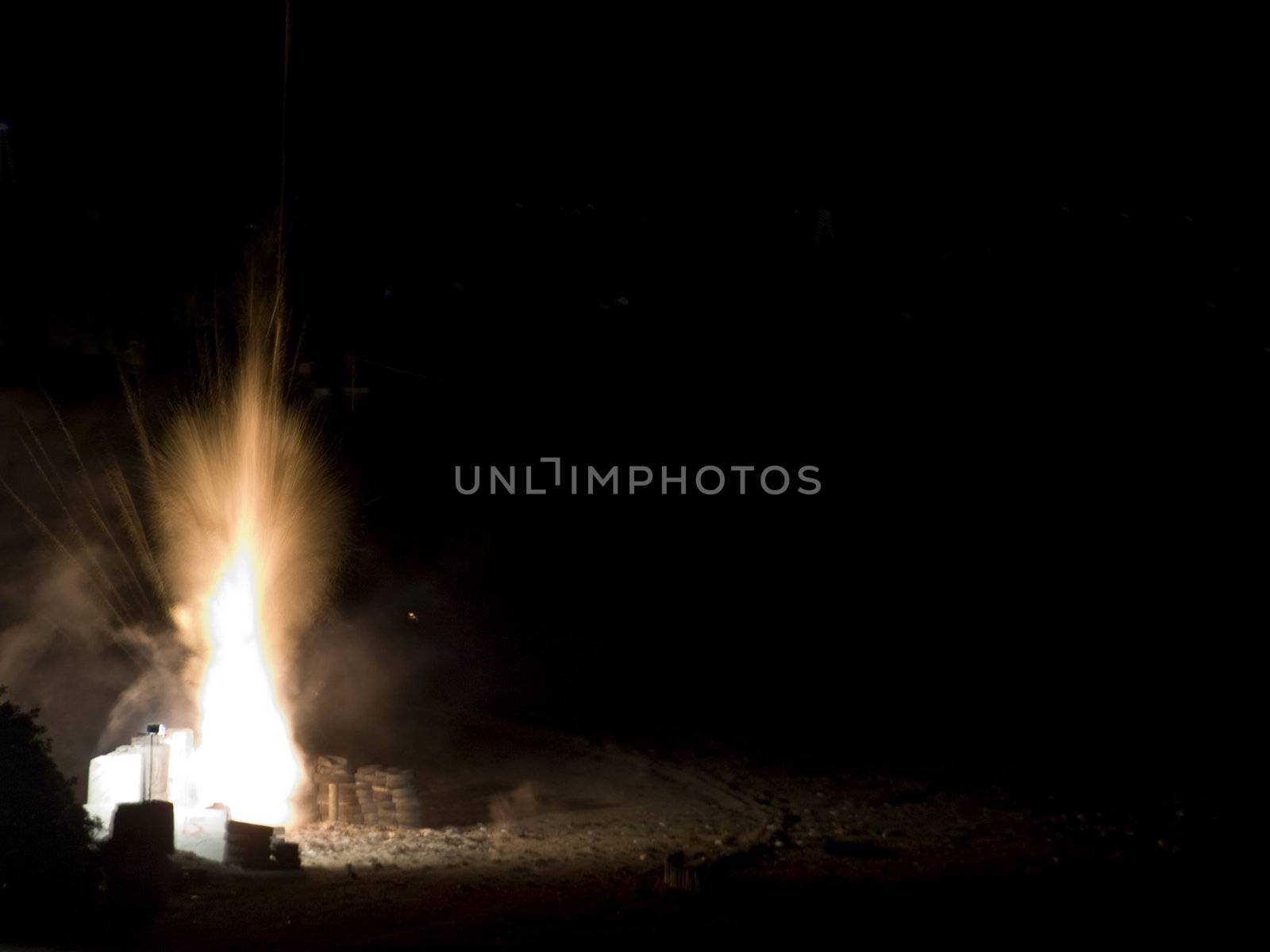 Second part of a series of two images showing a firework petard being let off