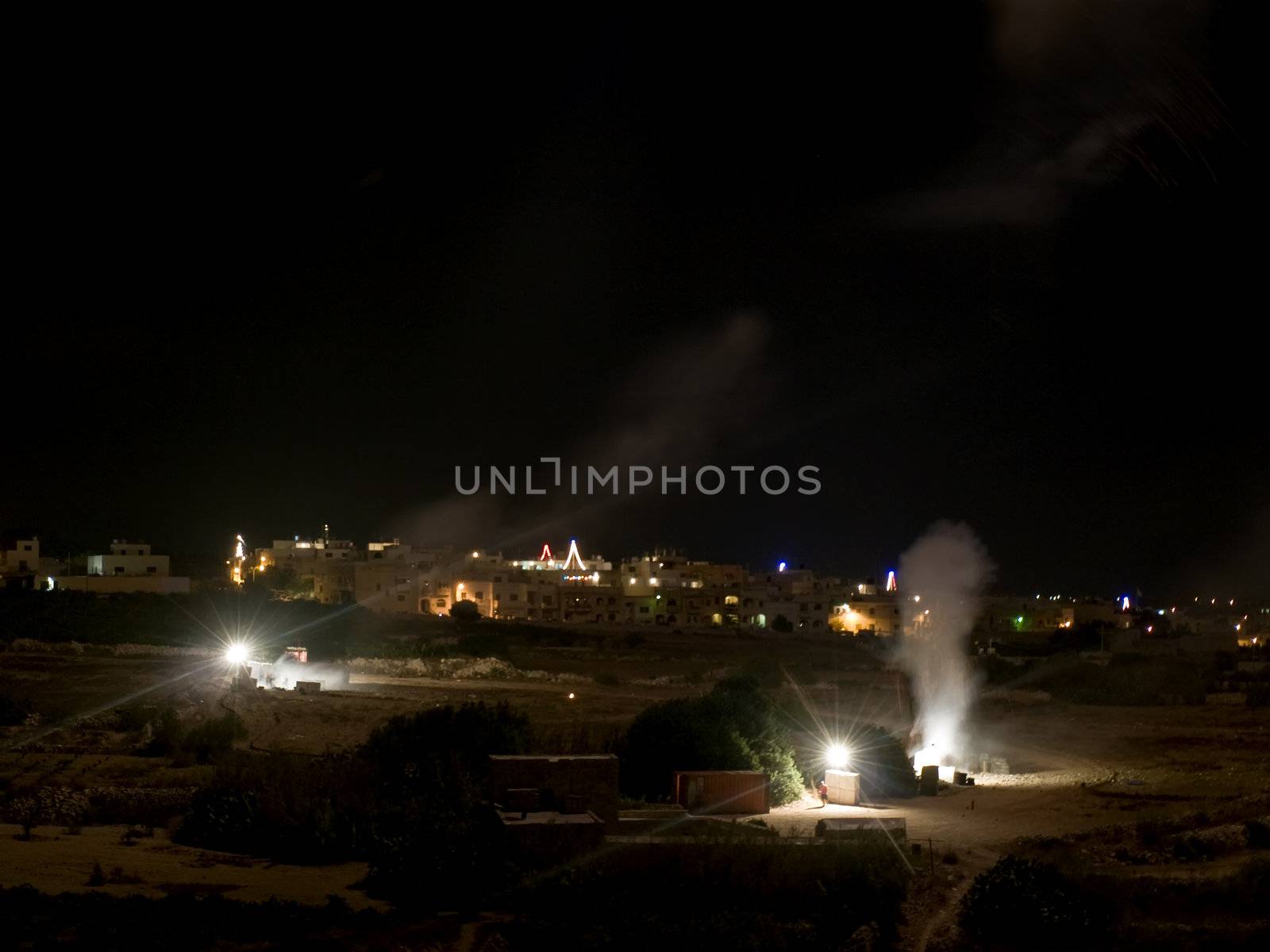 Workers in a fireworks factory in Malta letting off fireworks and hiding behind concrete blocks