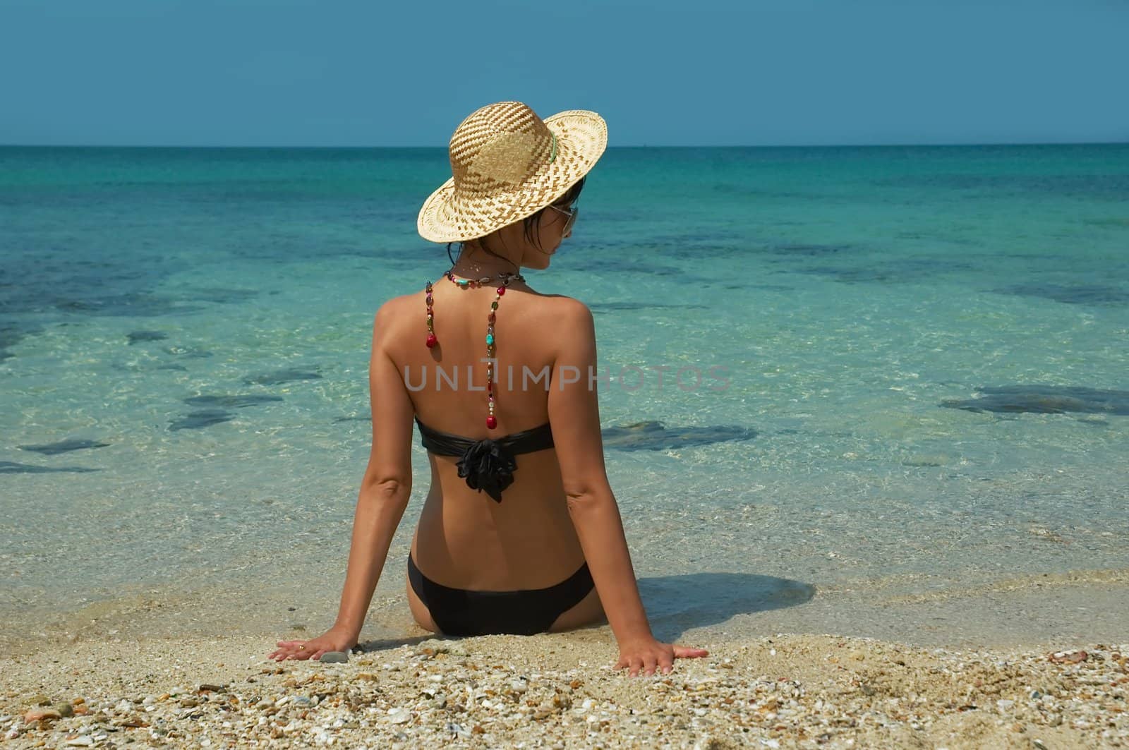 Beautiful women on the beach. Relaxing landscape.