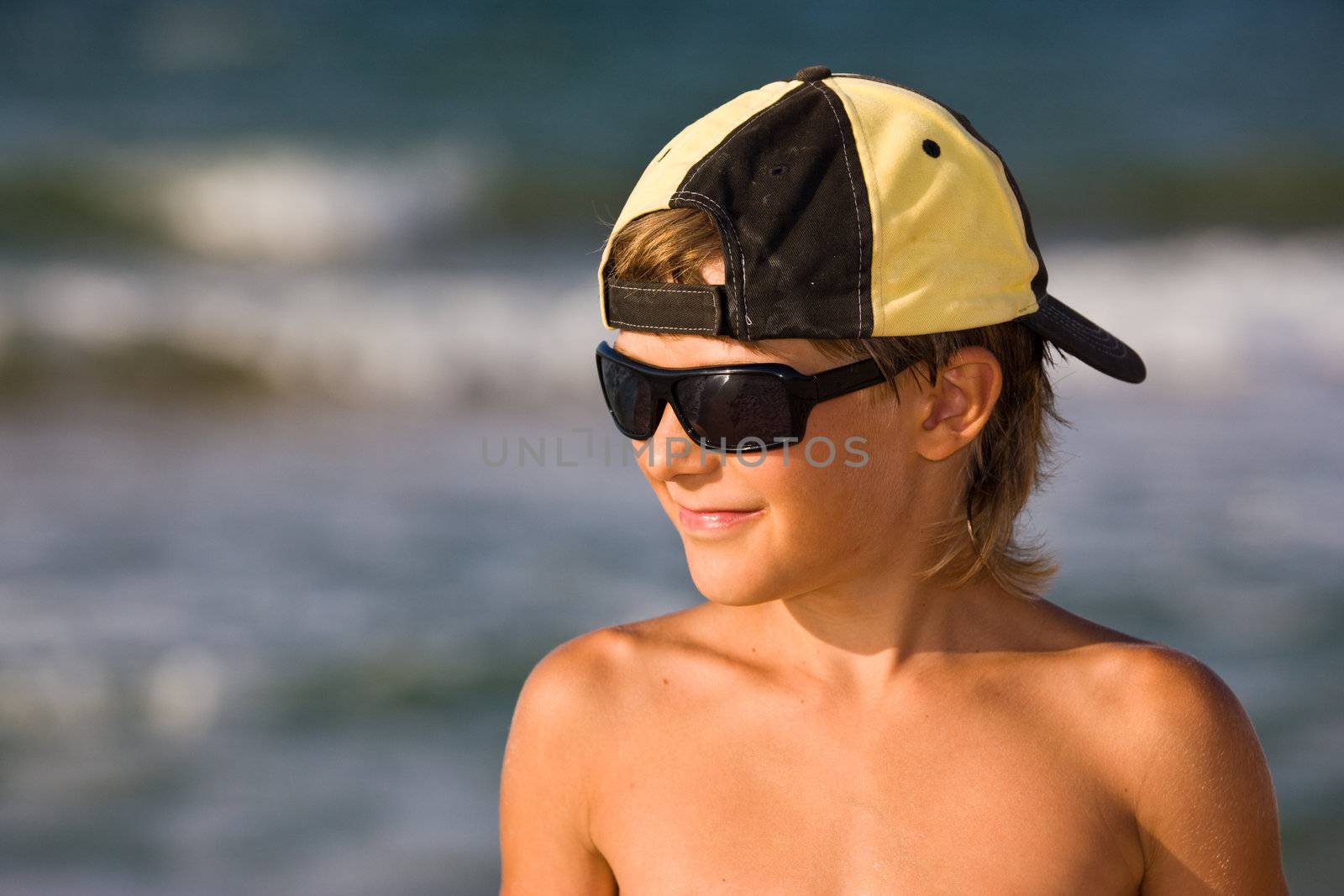 people series: portarit of boy on summer sea beach
