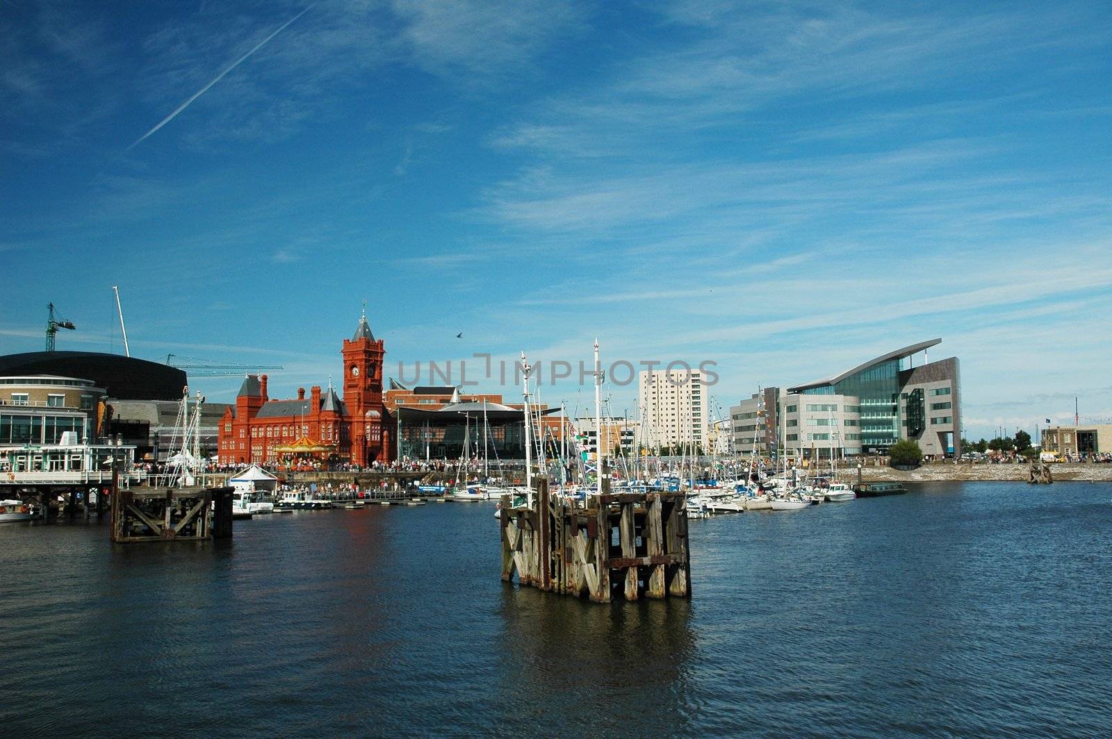 cardiff bay with red historical building in very summer nice day with blue sky covered by clouds