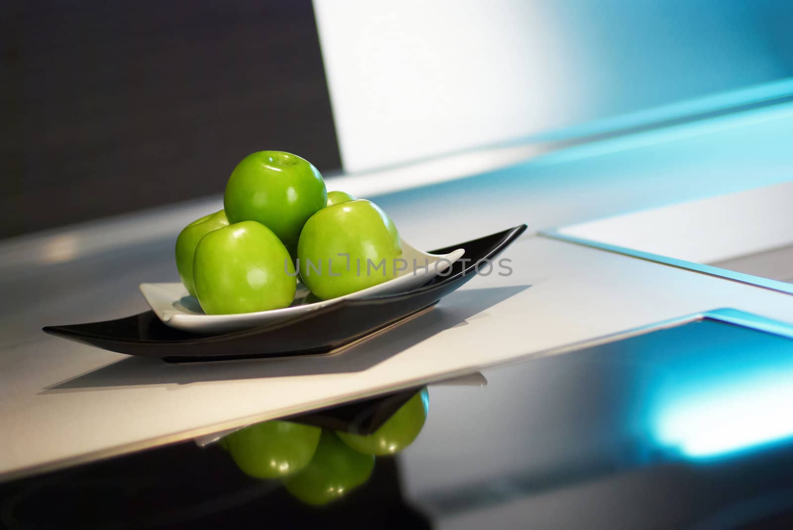 Granny smith apples on table in modern kitchen