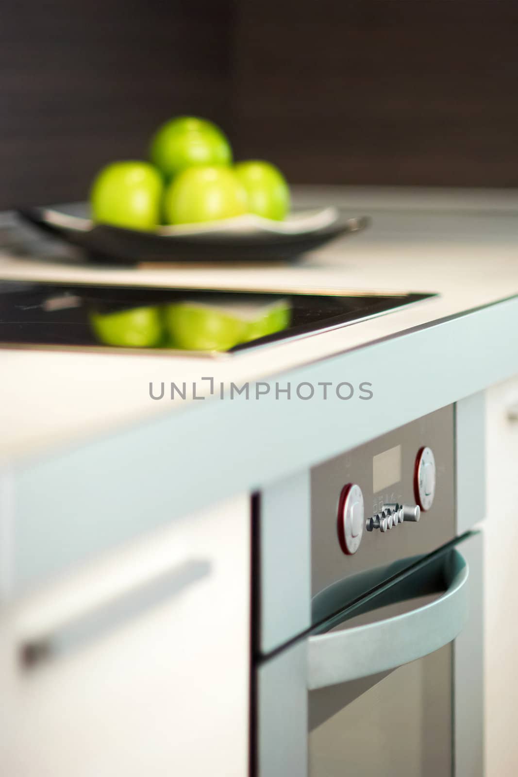 Granny smith apples on table in modern kitchen