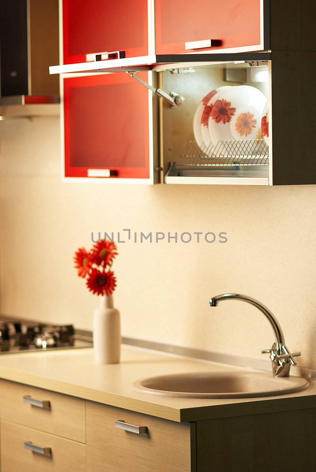 Beautiful flower on table in modern white kitchen