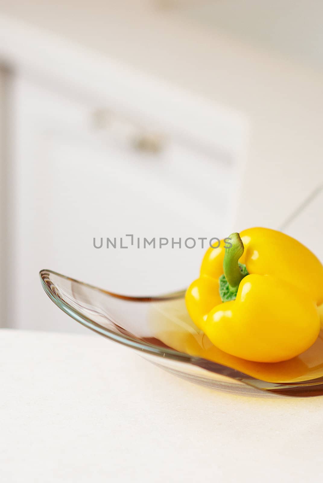 Yellow sweet pepper on kitchen's table by DmitryYakunin