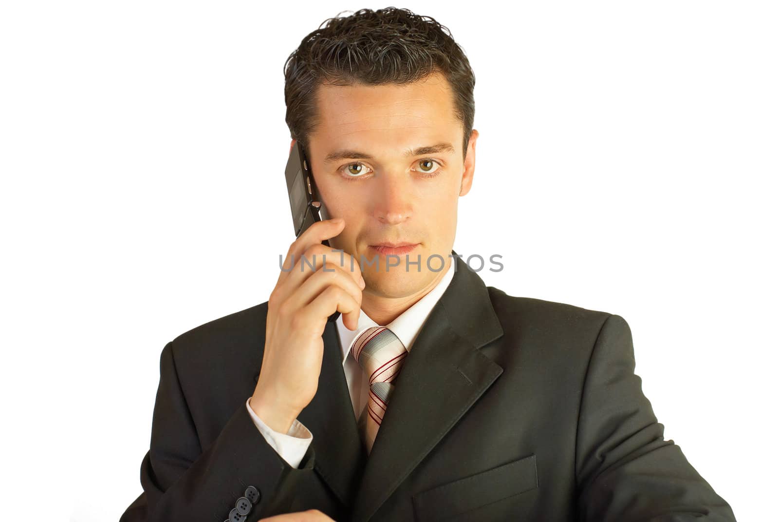 Businessman with cellphone and briefcase. Isolated on white.