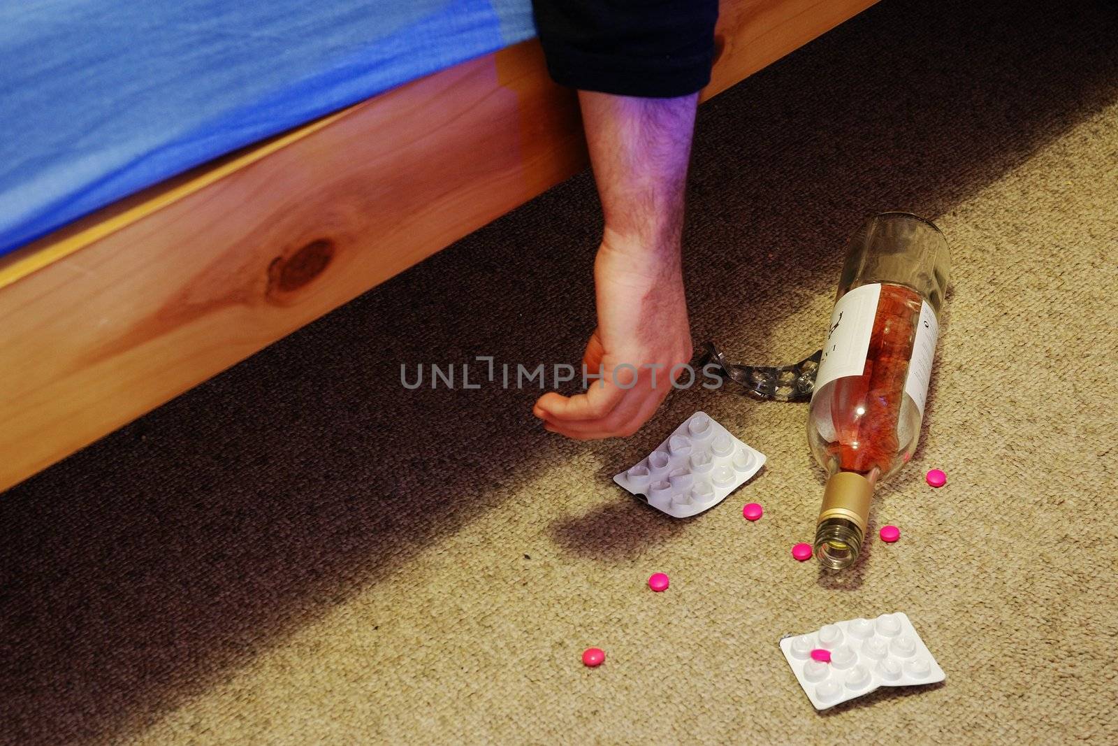 suicide in bed with pills and bottle of wine