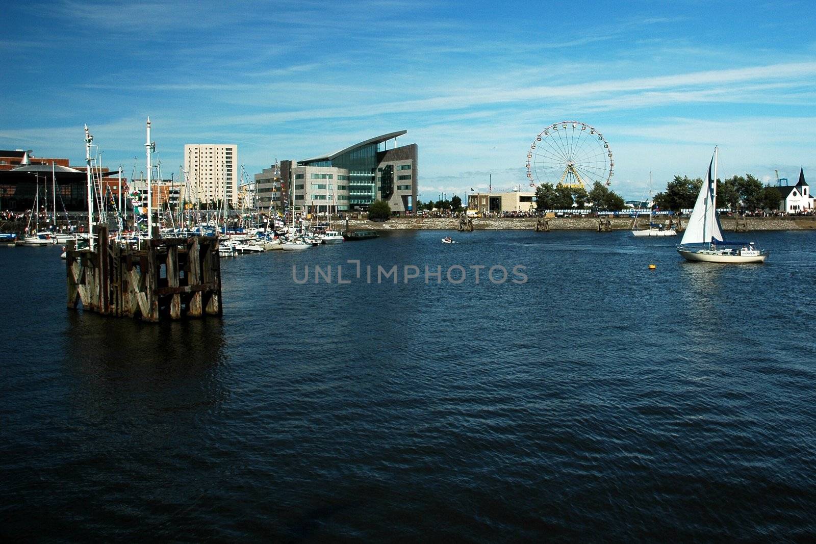 cardiff bay with blue sky, white clouds, horizontally framed shot