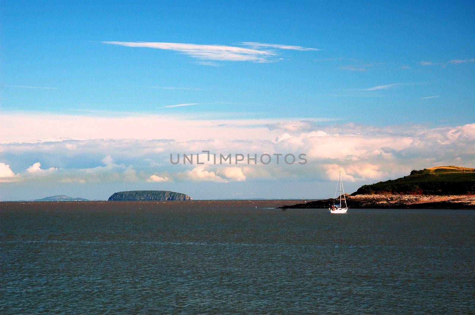 sully island and sea,  horizontally framed picture with boat