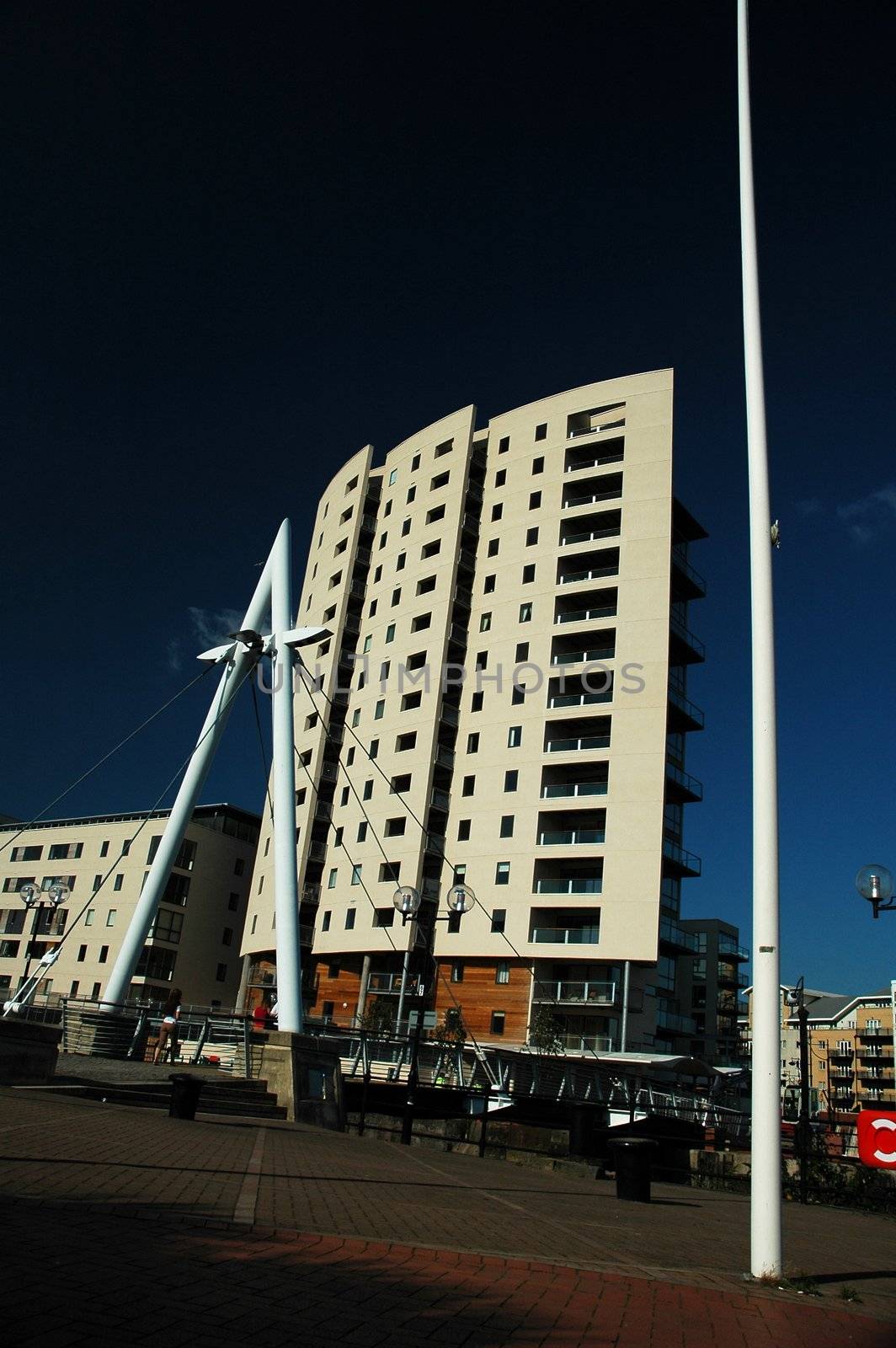 big high building in cardiff bay with blue sky