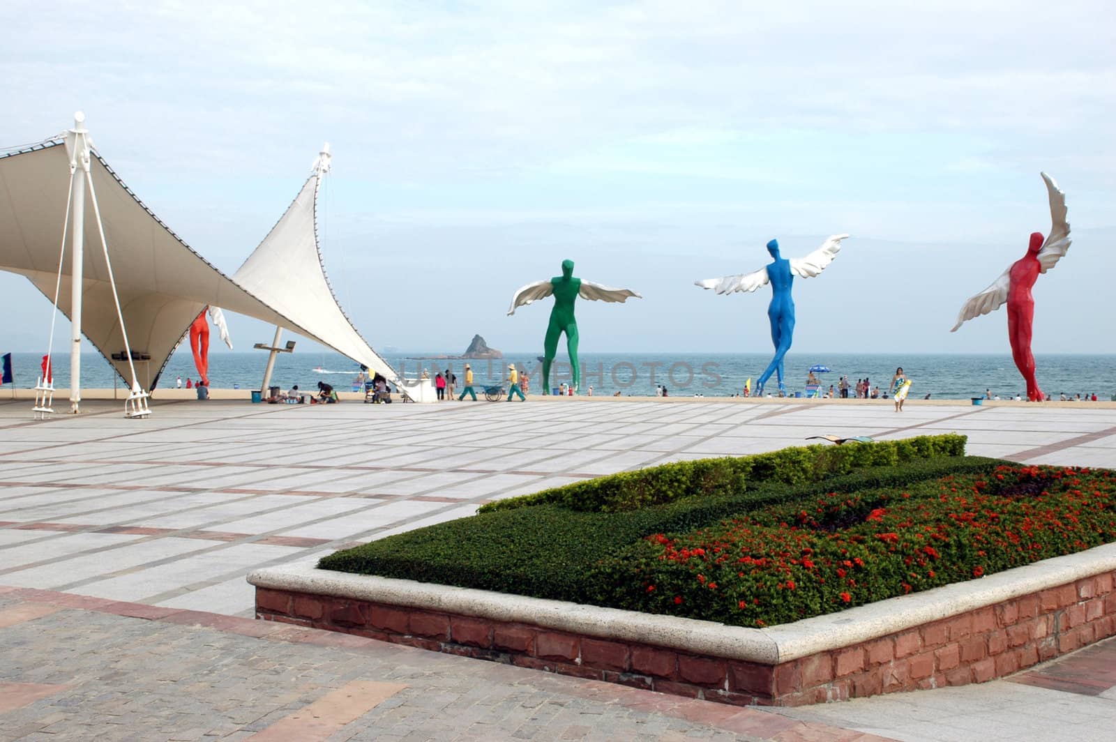 South China Sea, beach at DaMeiSha near Shenzhen city in Guangdong province. Place decorated by big angels sculptures.