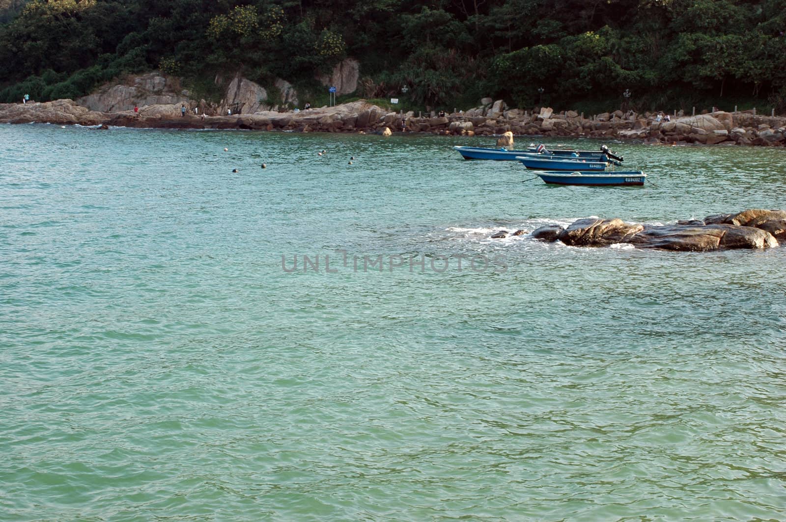 South China Sea, near Shenzhen city in Guangdong province. Simple boats waiting near coast.