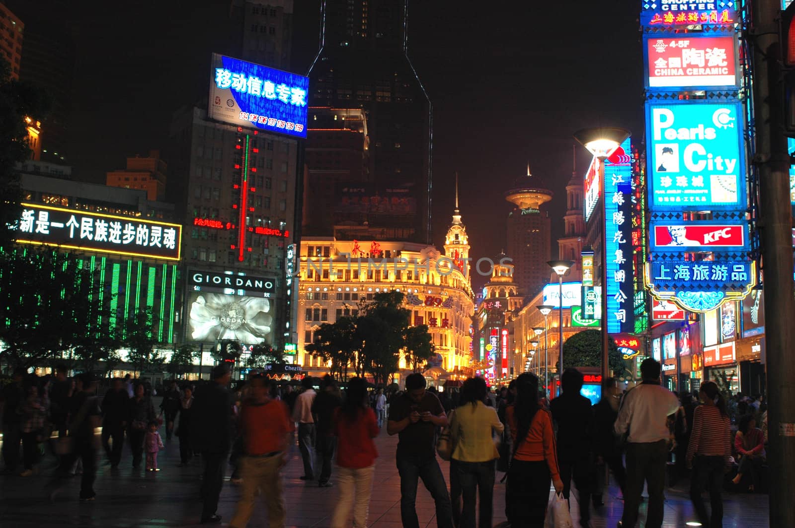 CHINA, SHANGHAI, NANJING ROAD - MAY 12, 2007: shopping paradise in China, famous Nanjing Lu with thousands of shops, neon lights, crowd of people.