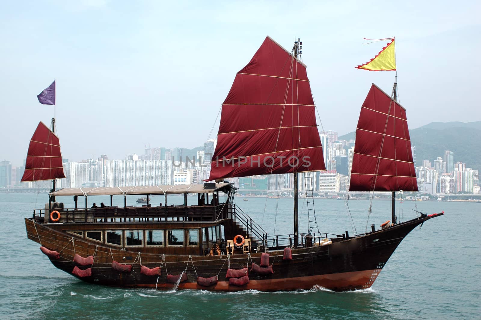 Hongkong, harbour between Kowloon and Hongkong Island with beautiful ship made in old style.