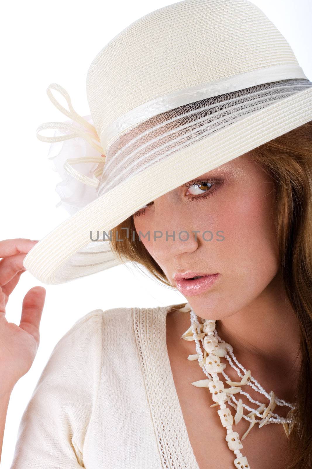 Young pretty woman in a white hat by mihhailov