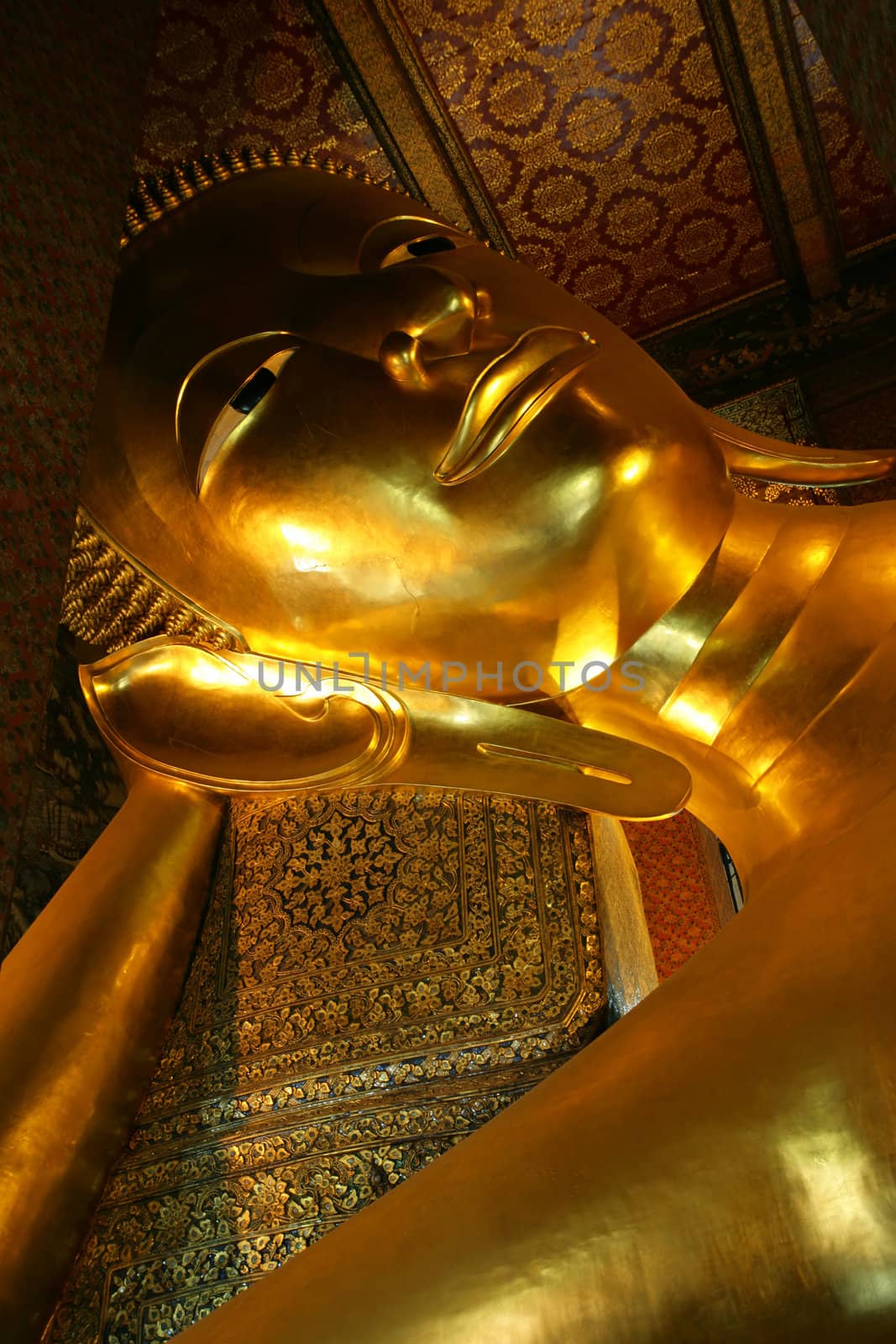 The huge golden sleeping Buddha, in Bangkok, Thailand.
