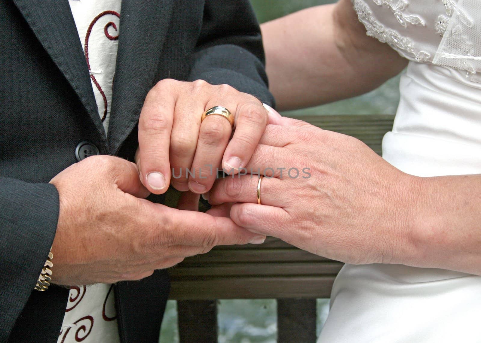 Bride and Groom showing off their rings.