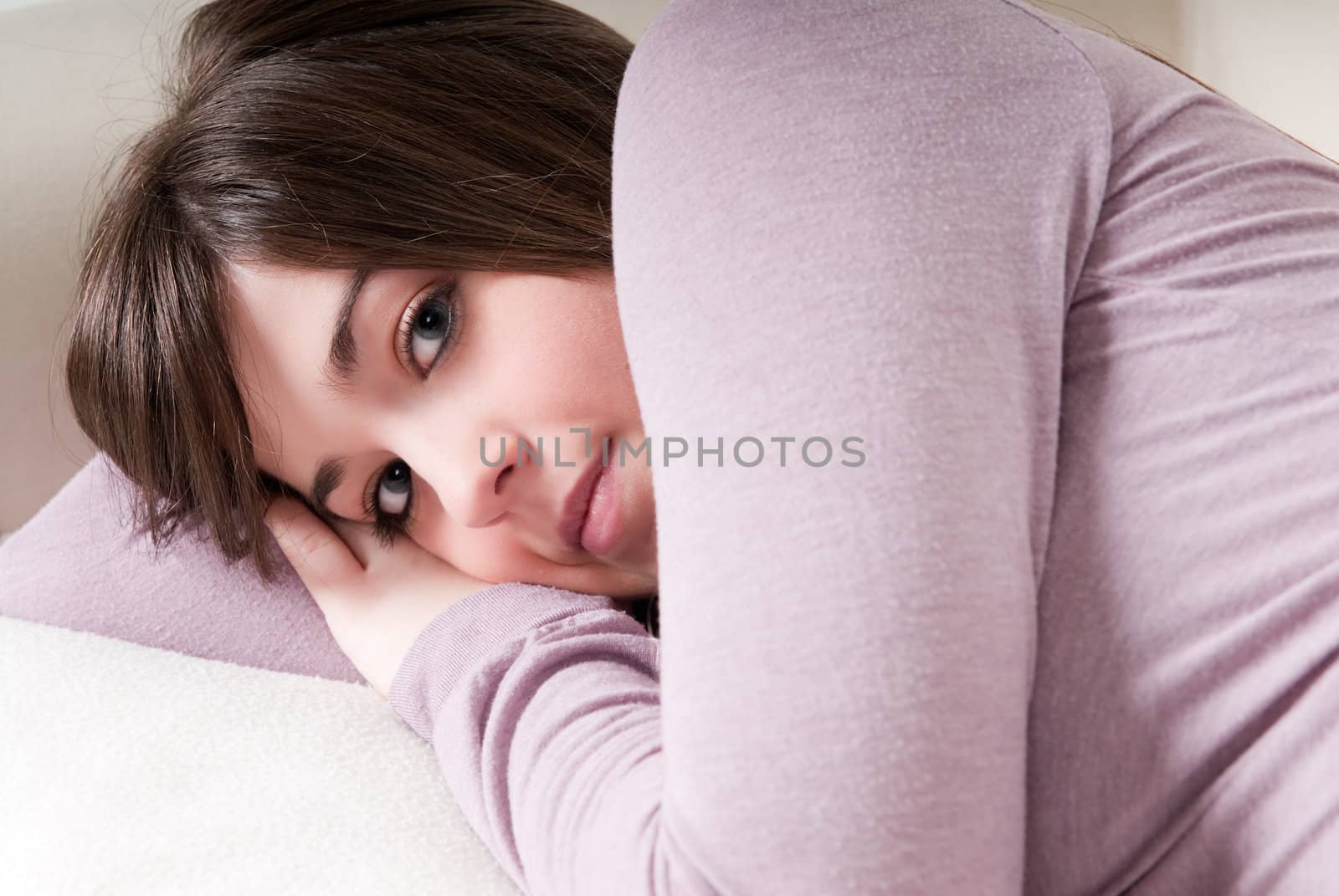 Young woman portrait "relax" lying on couch. 