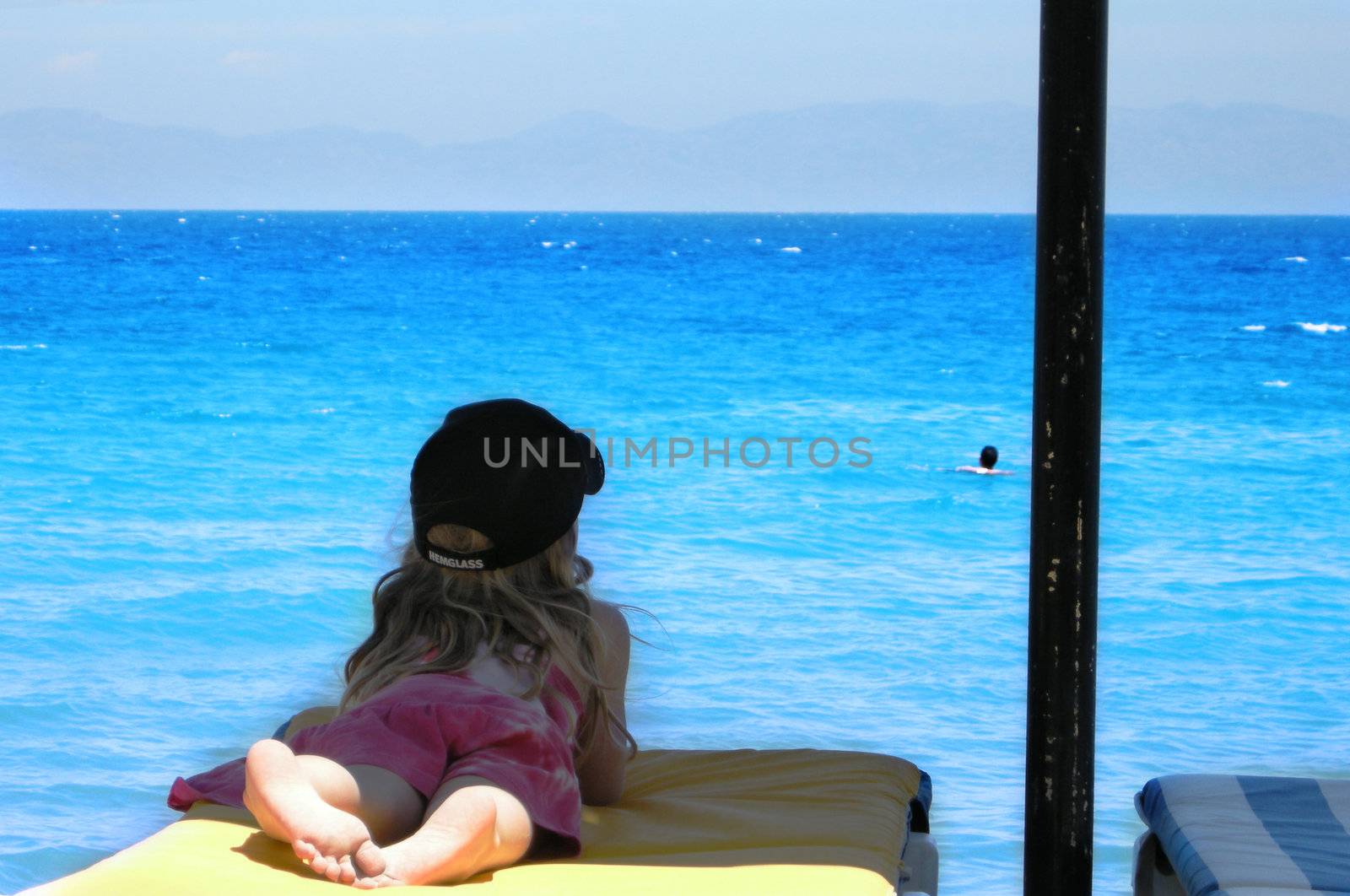 girl relaxing by the beach