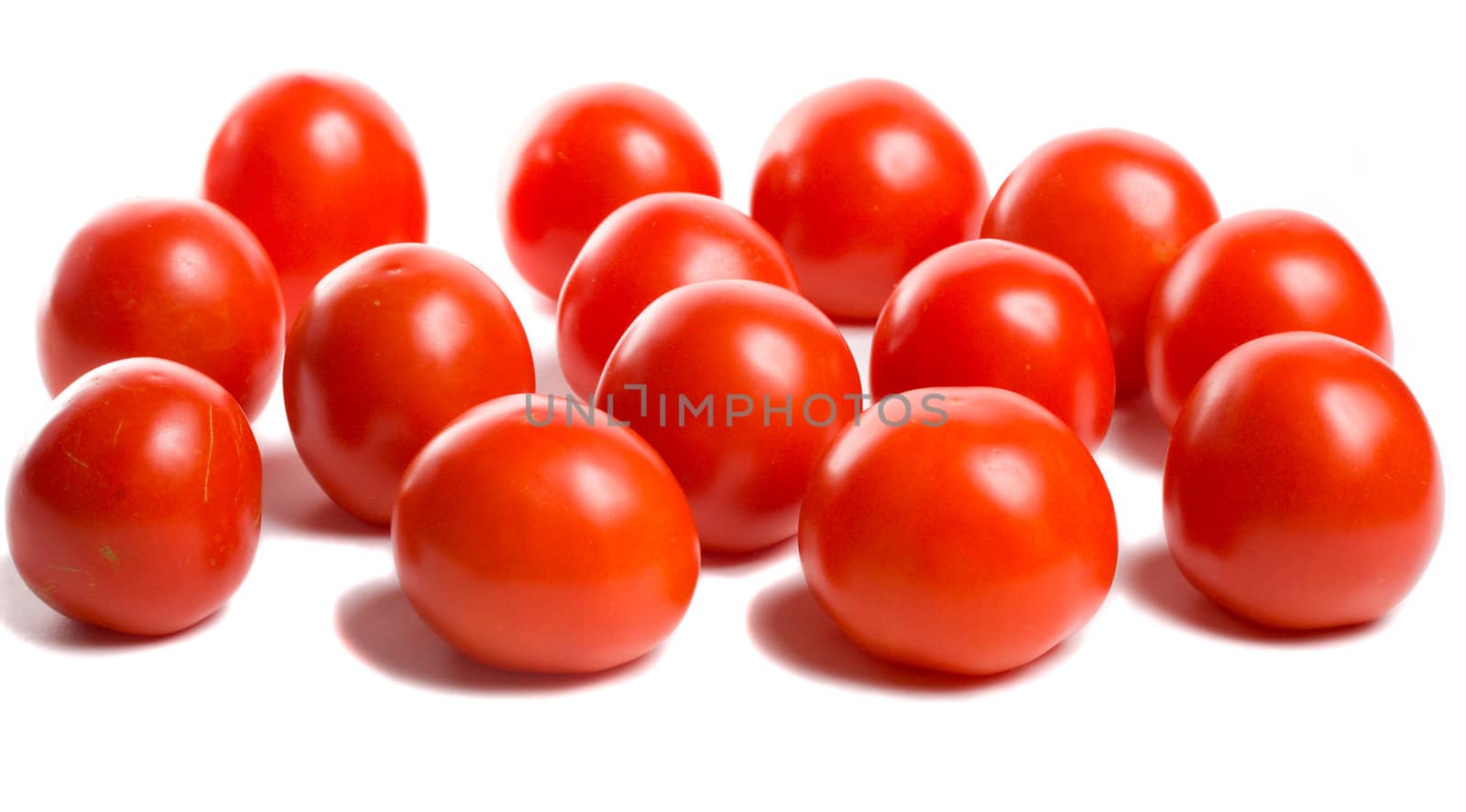 close-up many ripe tomatoes, isolated on white