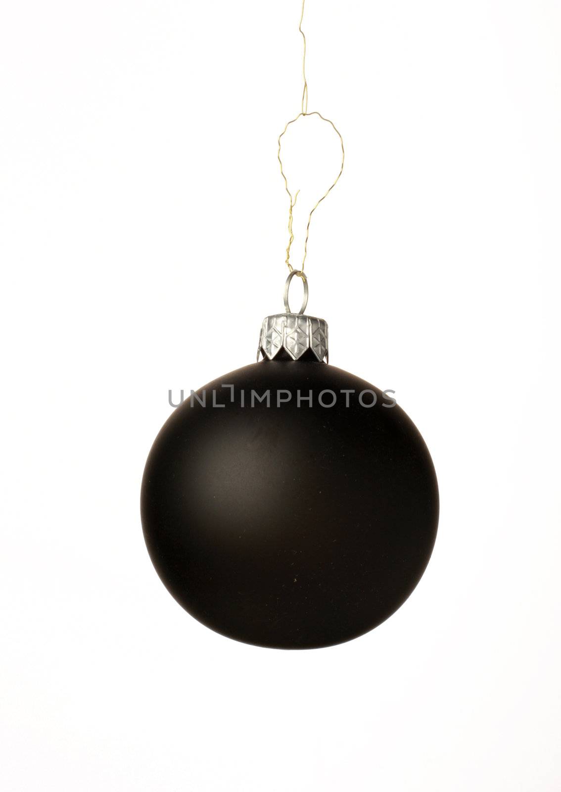 A black christmas ball hanging from golden thread, shot in studio isolated on white. Perfect for your holiday designs or ads
