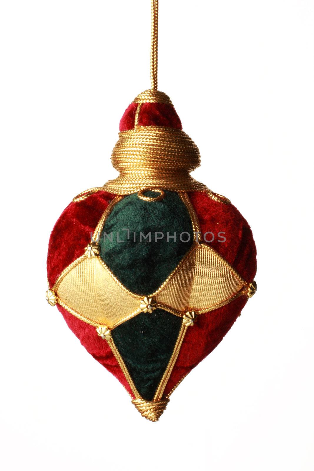 christmas ball hanging from golden thread, shot in studio isolated on white. Perfect for your holiday designs or ads