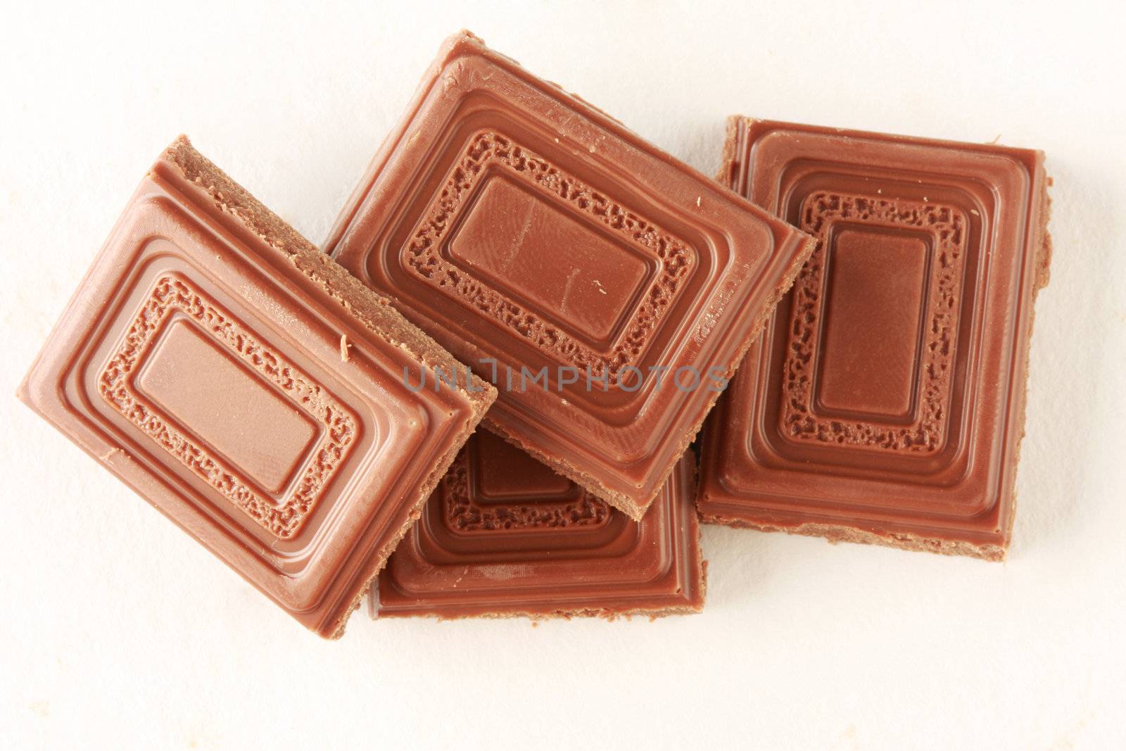 Milk chocolate isolated on white, shot in studio