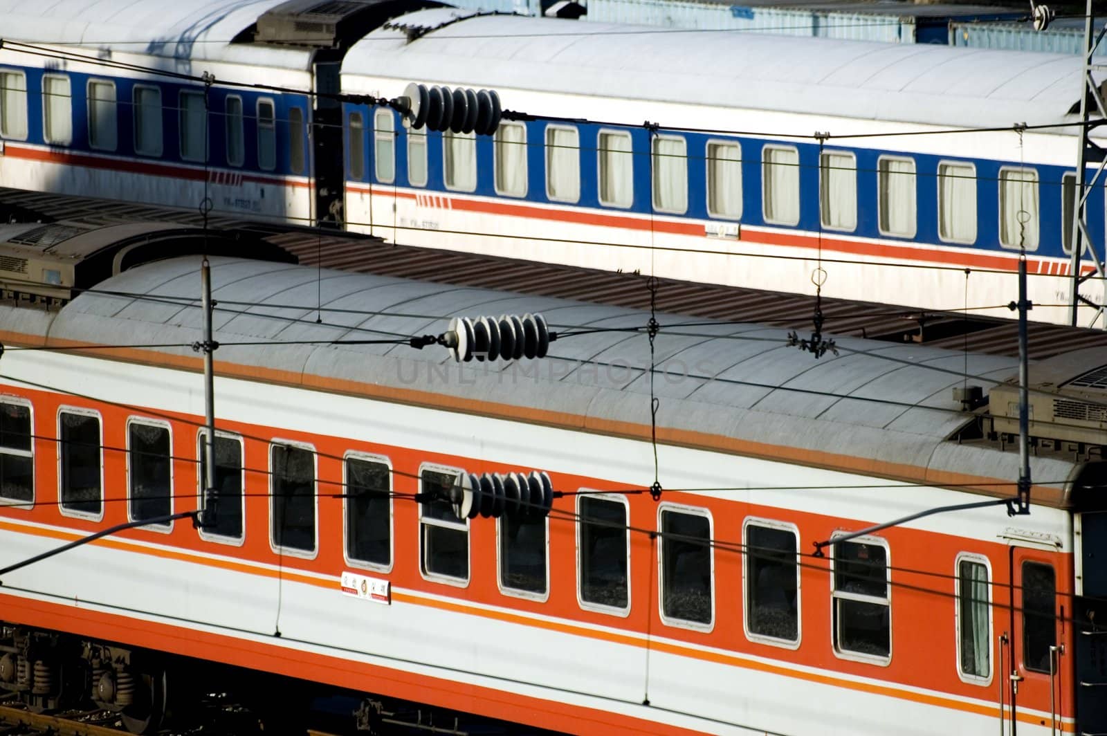 Chinese railway. Colorful cars waiting at the station in Shenzhen city.