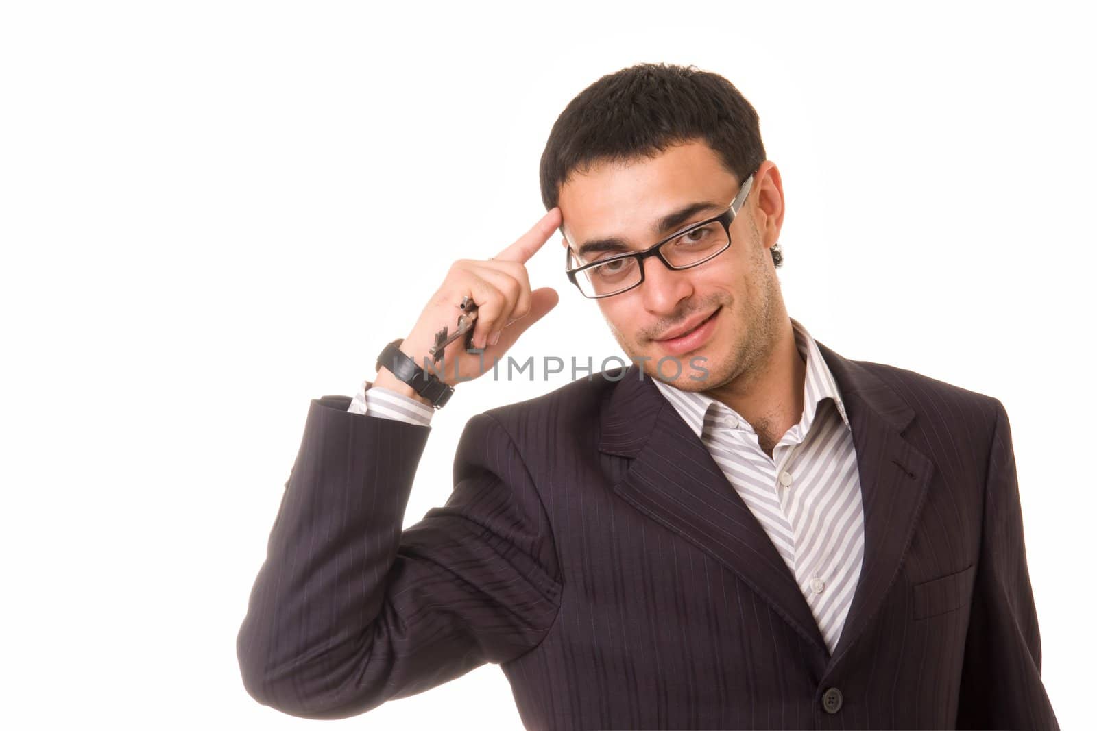 smiling businessman with keys on a white background