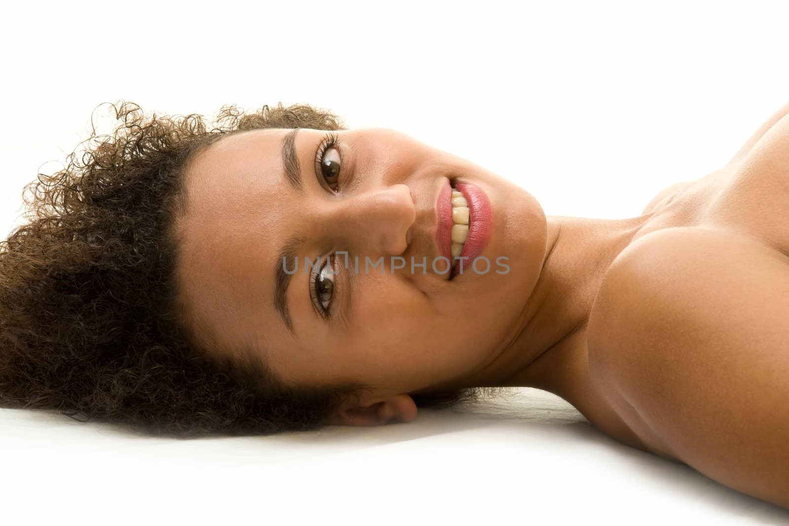 beautiful woman lays on a white background