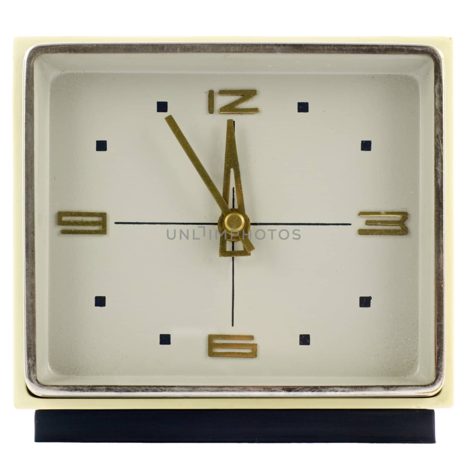 Vintage mechanical wind-up alarm clock over white isolated