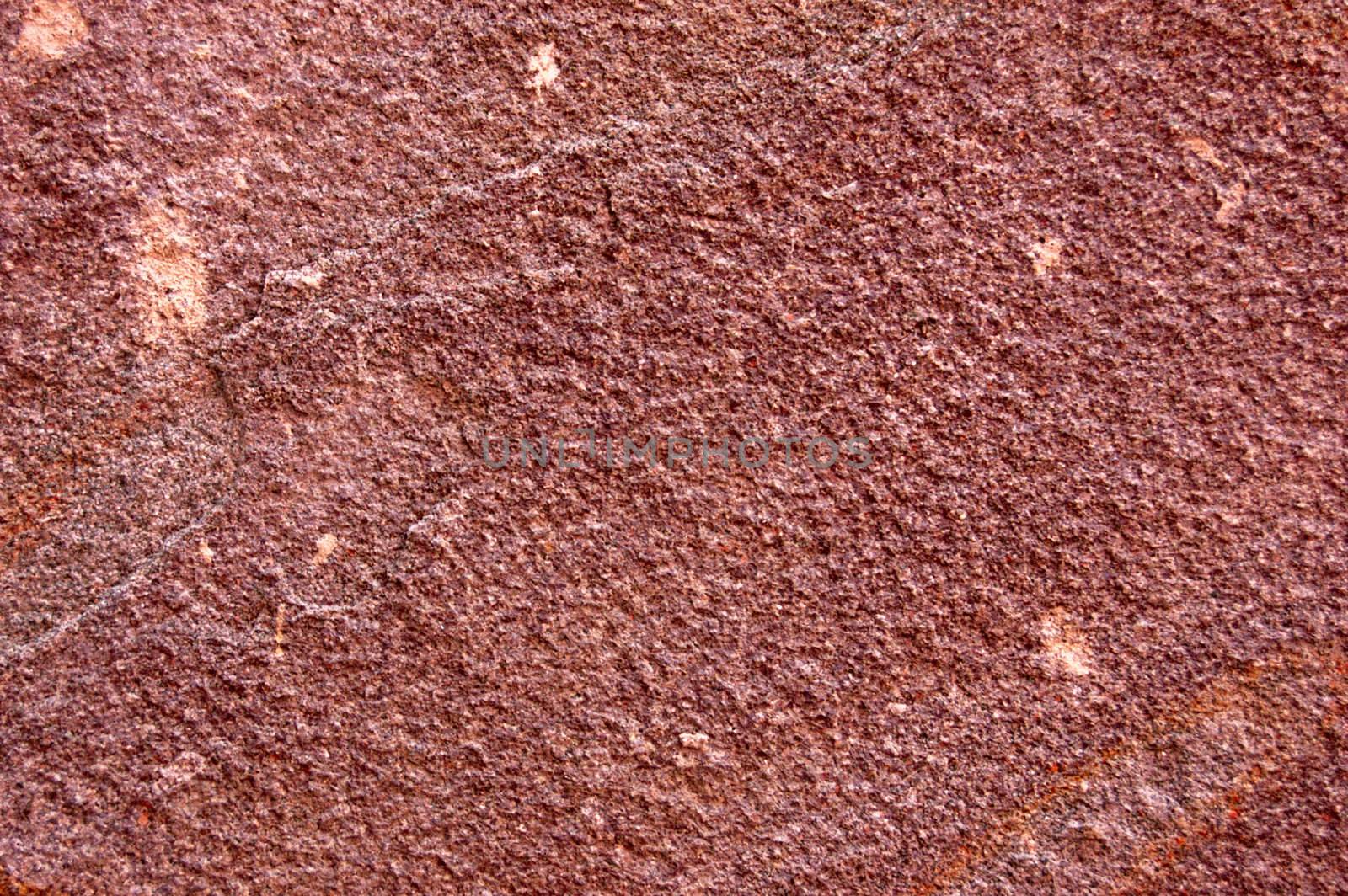 brown rough surface of wild stone .