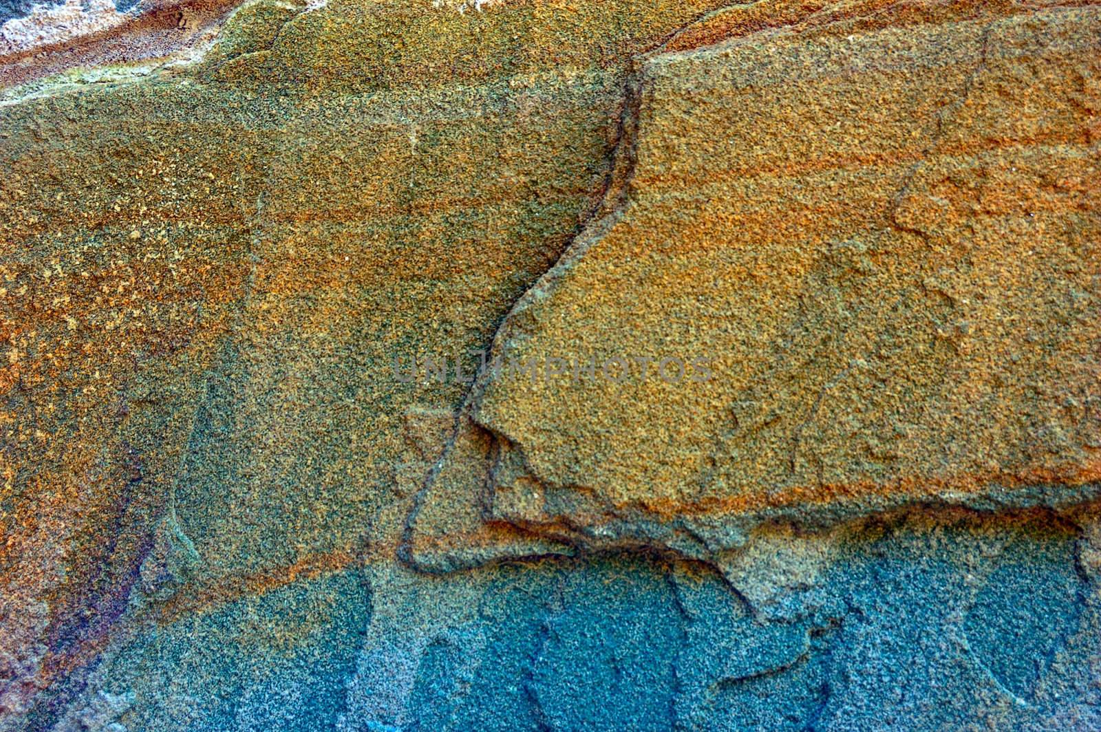 colored (prevaling blue and brown) rough stone surface