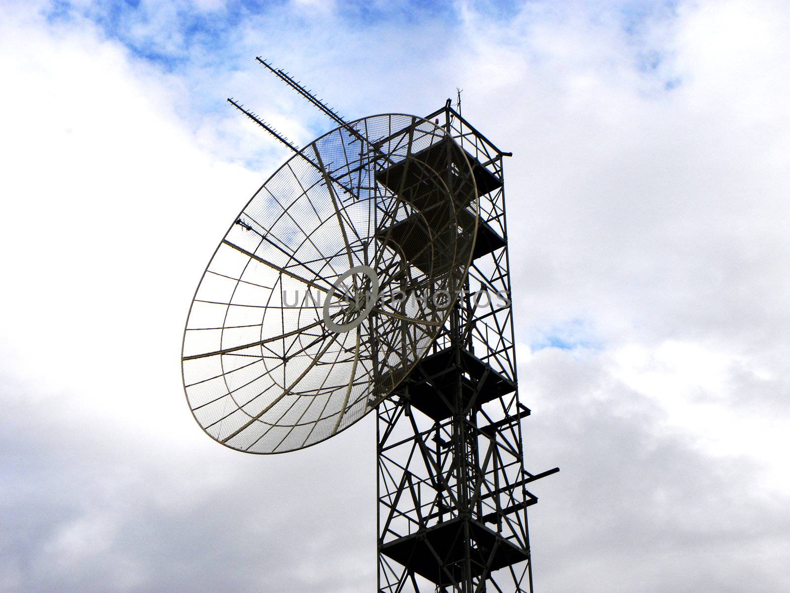 contrast of light in the image of antenna pointing at the sky. Represents the technology and the modern world and the Internet, cable television, cell phones and other