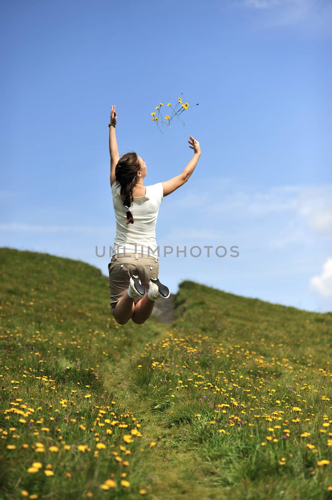 Woman enjoying her summer holidays at the mountains