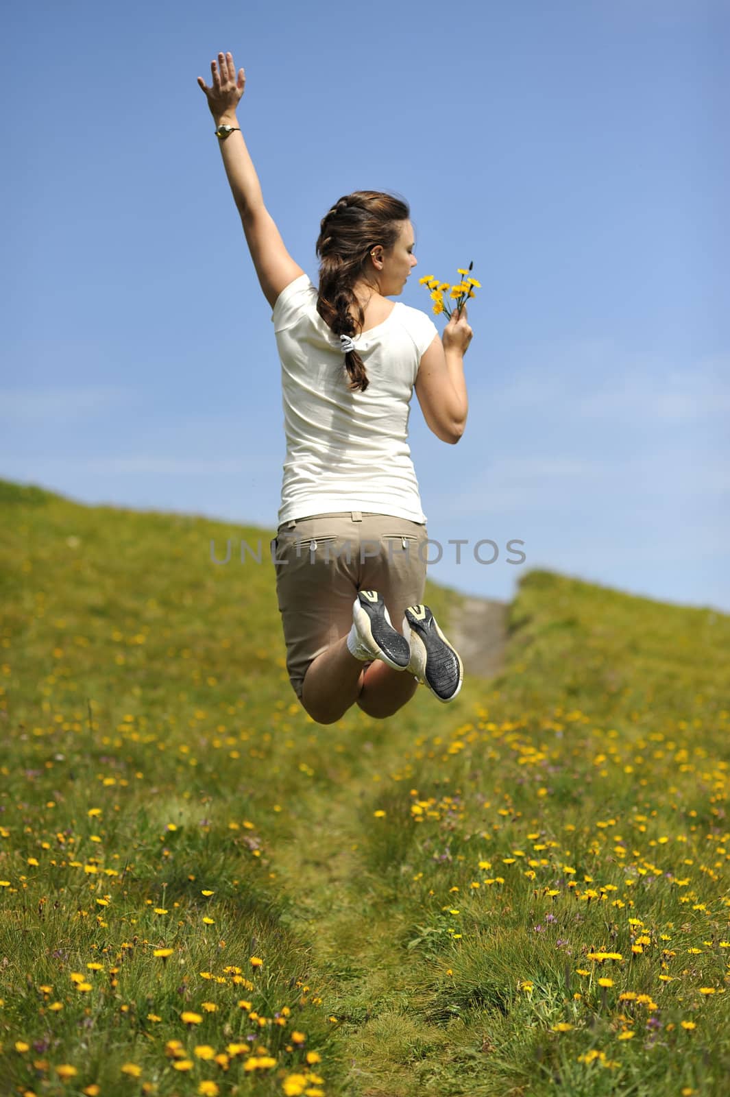 Woman enjoying her summer holidays at the mountains