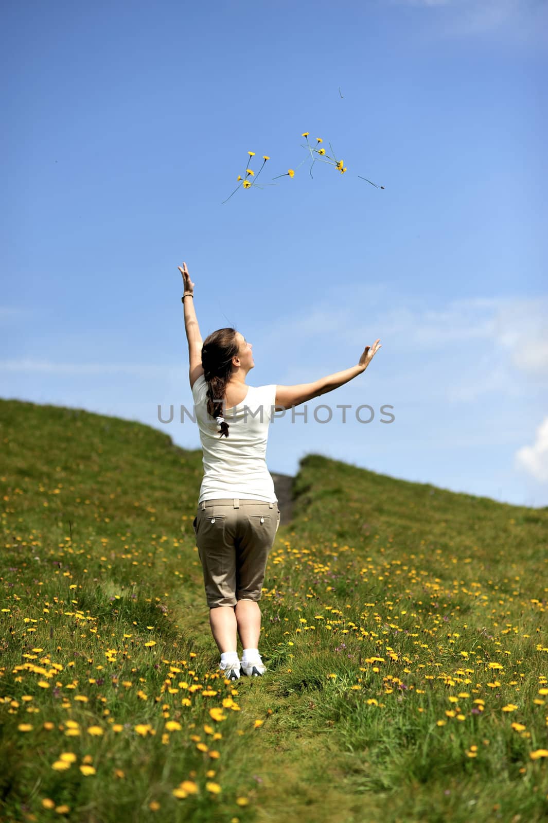 Woman enjoying her summer holidays at the mountains