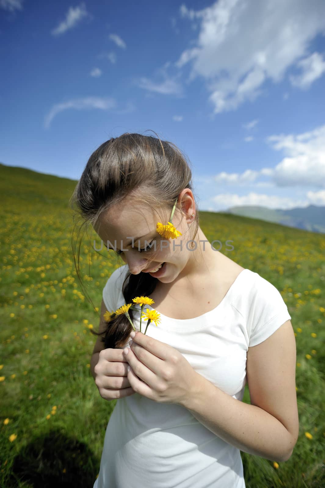 Woman enjoying her summer holidays at the mountains