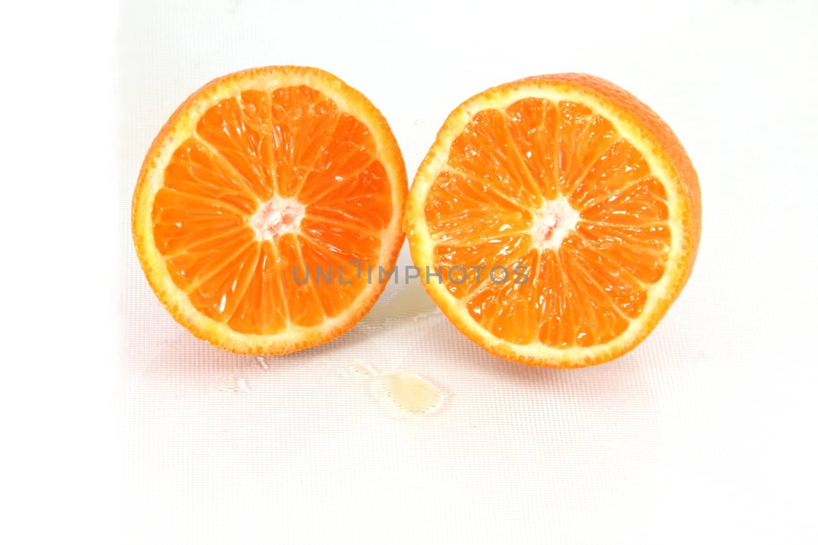 Fresh orange slices isolated on white.
