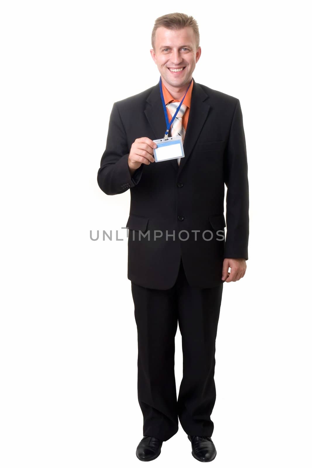Young businessman holds an empty badge, isolated on white background.