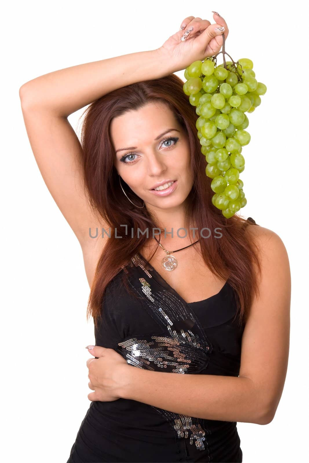 beautiful girl with green grapes on a white background