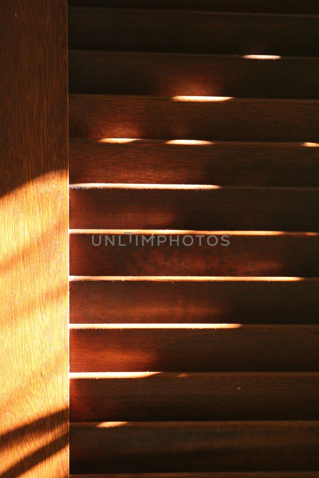 Brown shutters with dust in evening light.