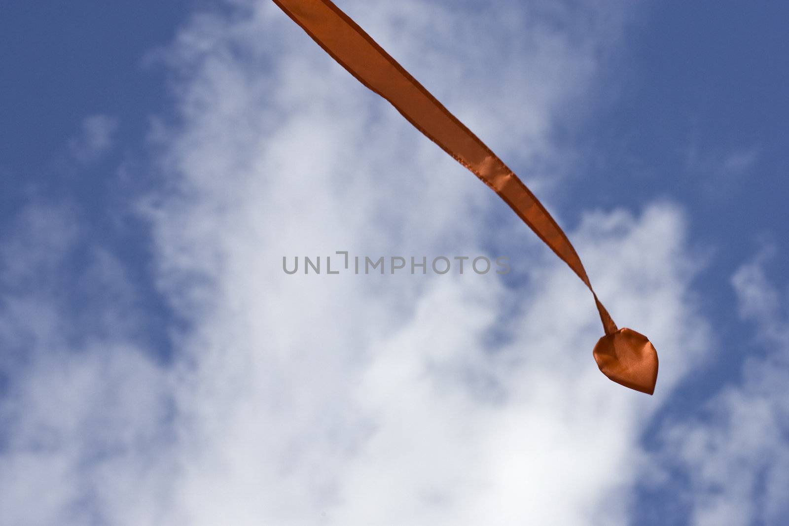 A streamer flying in the air on a bright summer day.