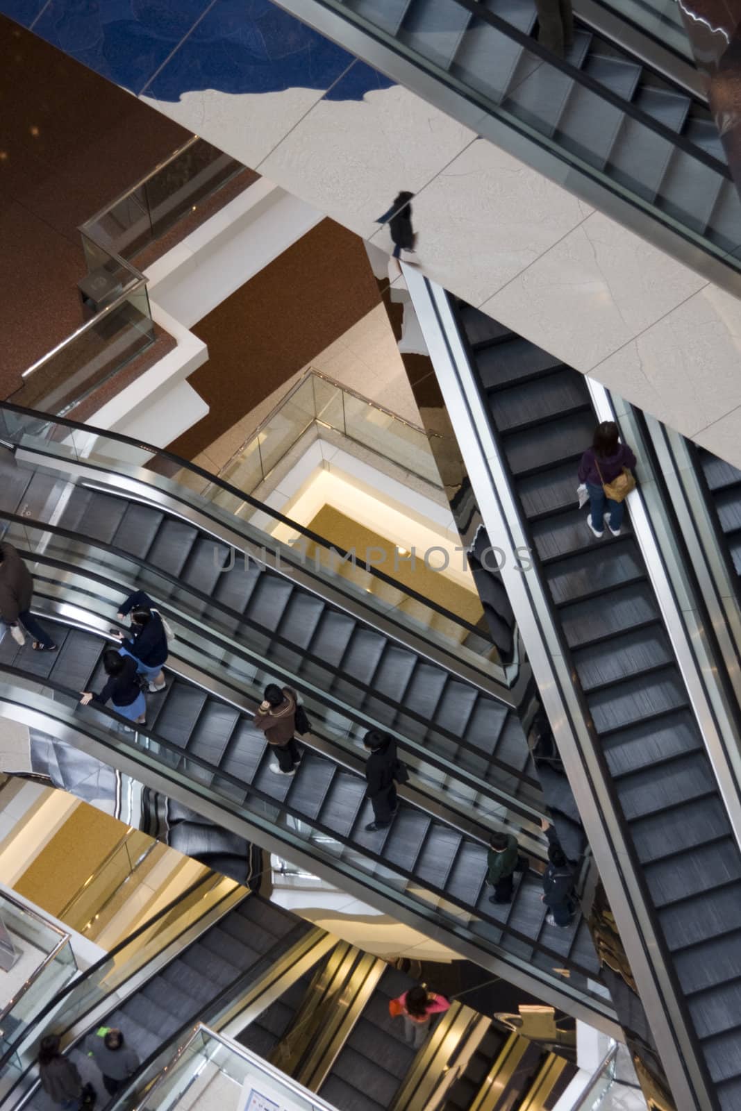 It is a close up with escalator in a building.