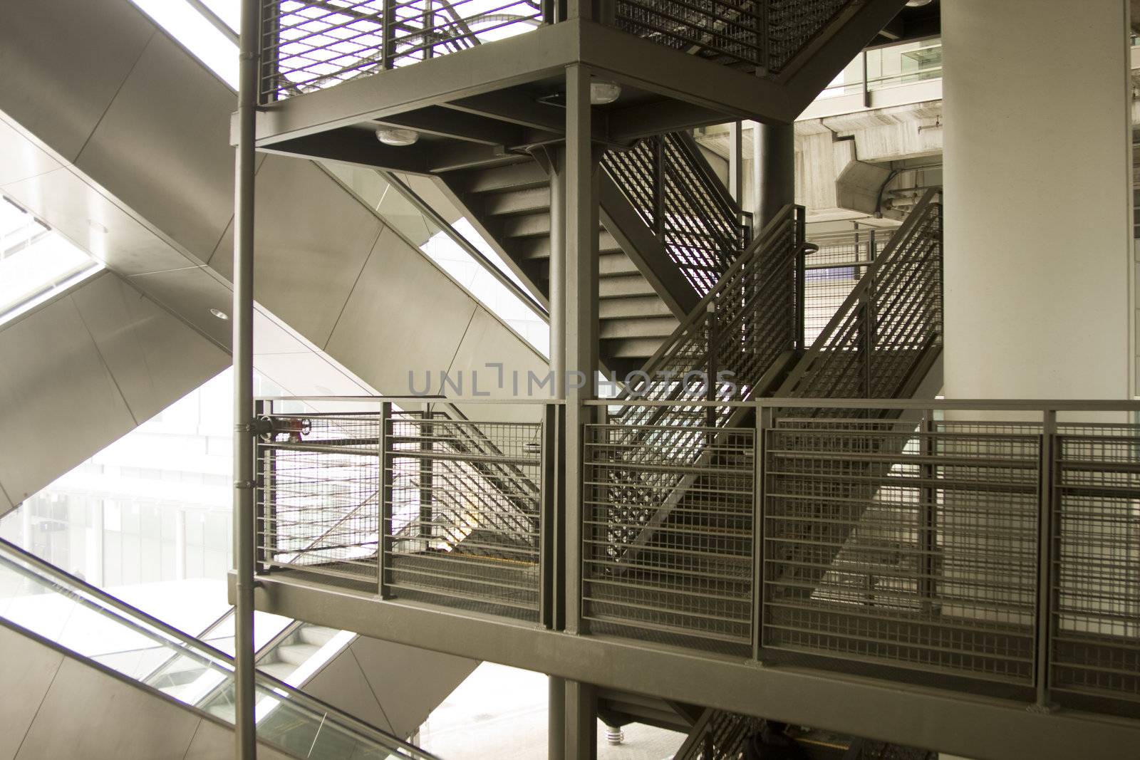 it is a modern escalator and a tradition stairs, made a composition.