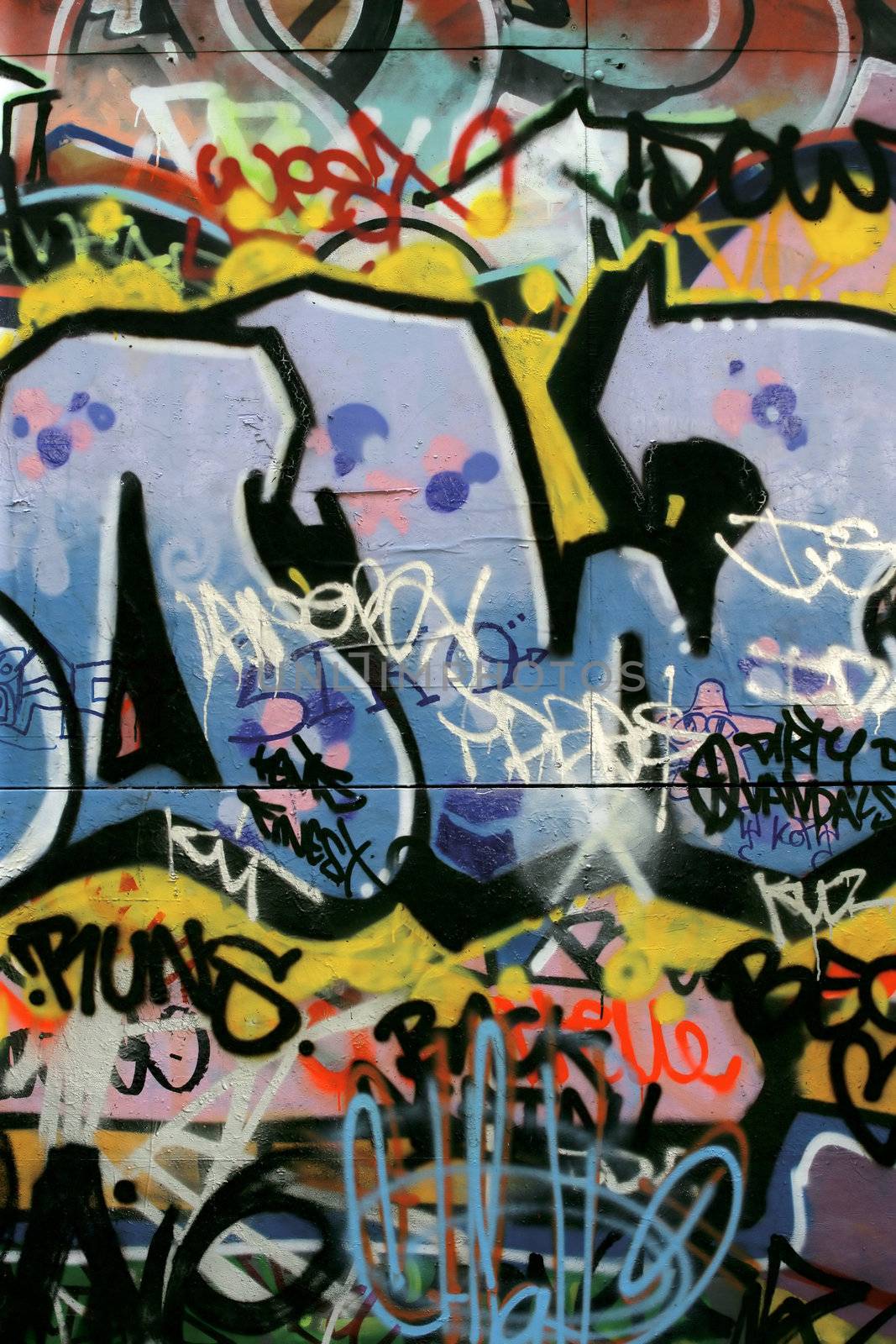 Graffiti and tagging vandalism in a back alley of London, England where skateboarders congregate.
